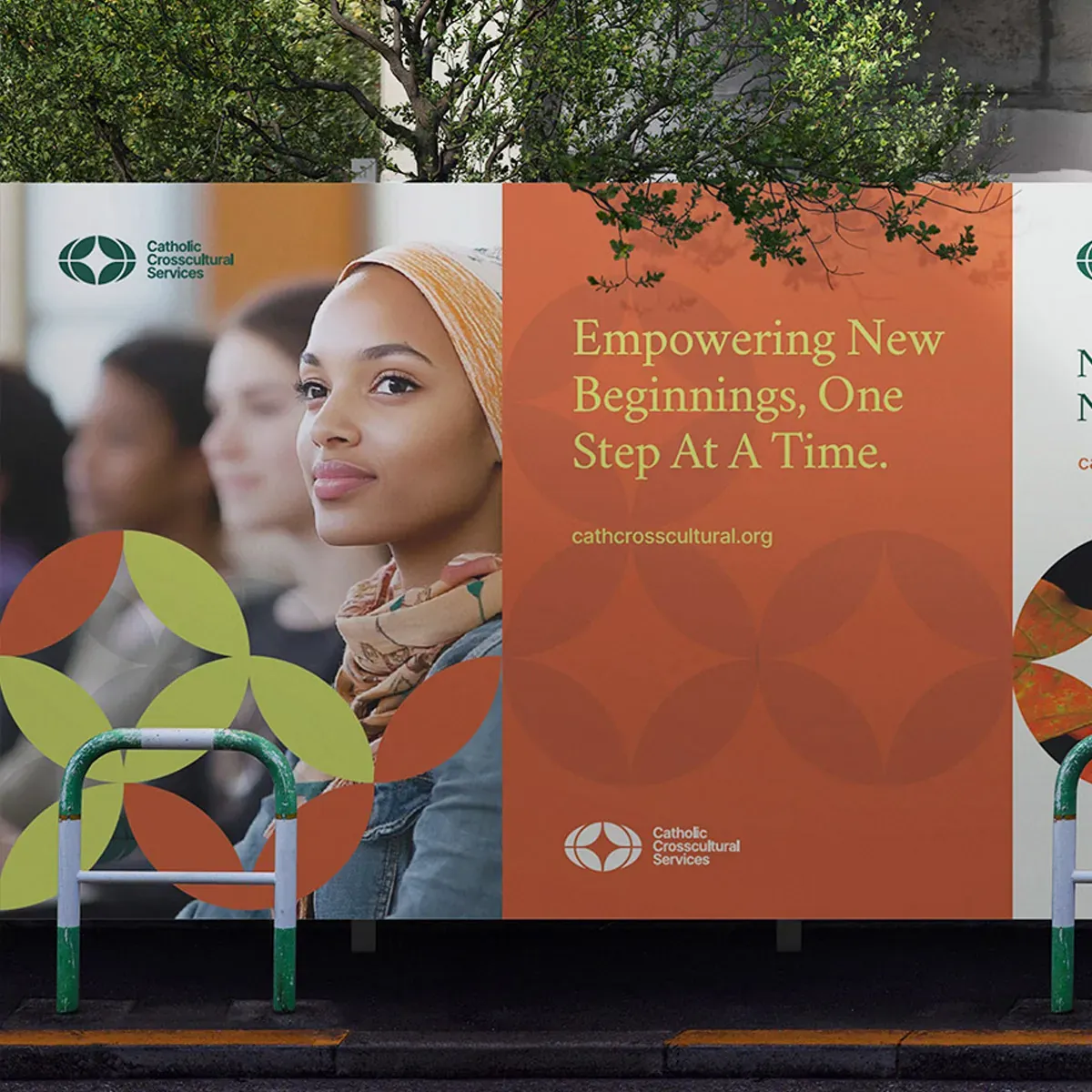 Catholic Crosscultural Services street poster reading Empowering New Beginnings, One Step At A Time