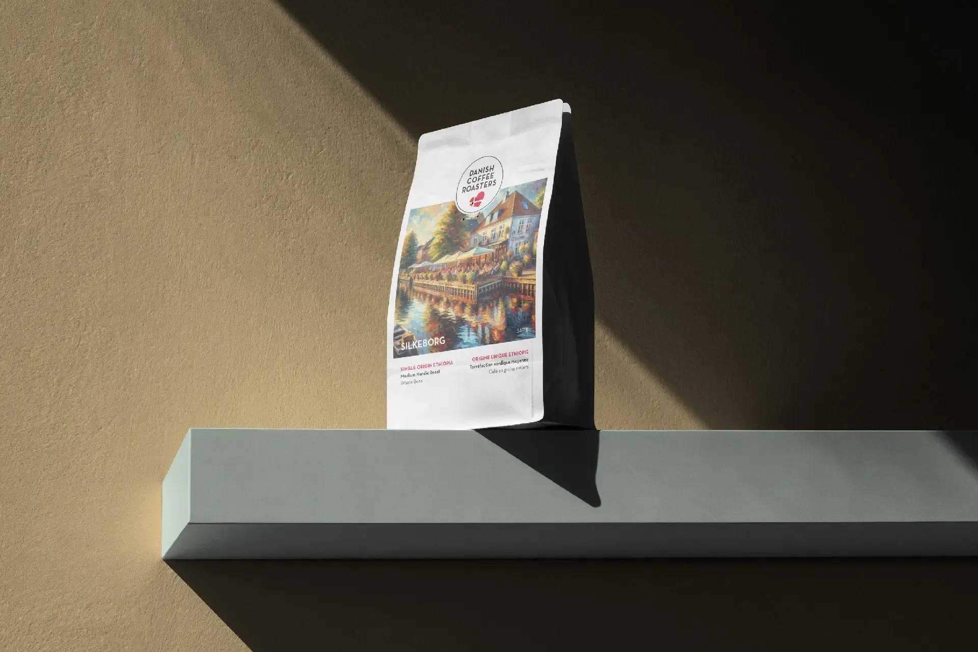 Illustrated coffee bag packaging standing on a shelf in warm light