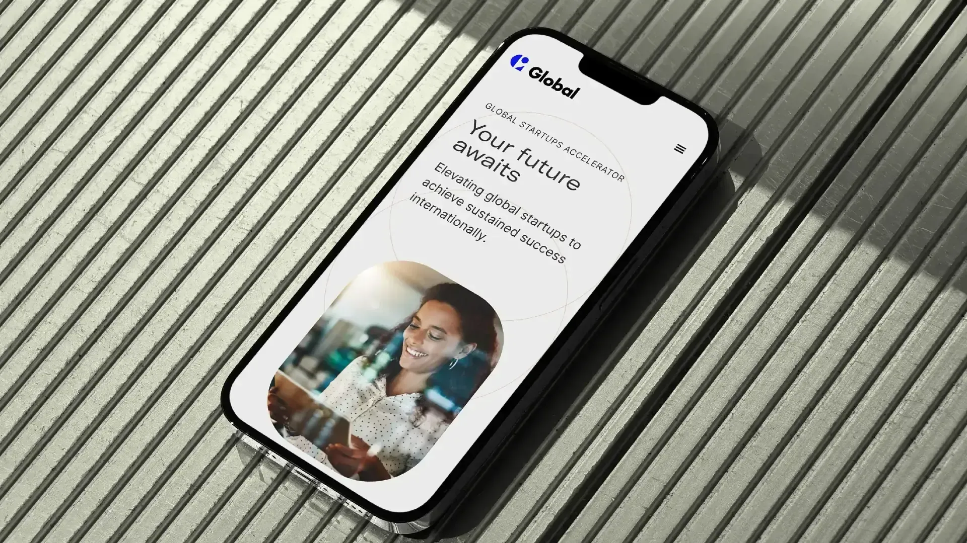 Global Startups Accelerator mobile website on a phone, headline Your future awaits