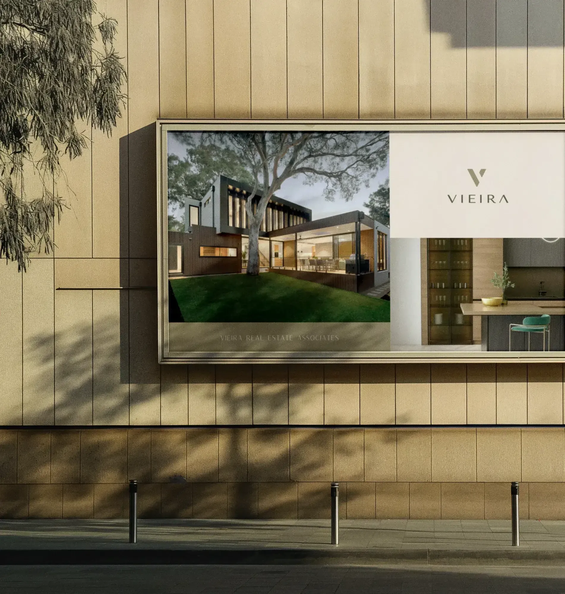 Vieira real estate sign on a building facade showing a modern home with a green lawn