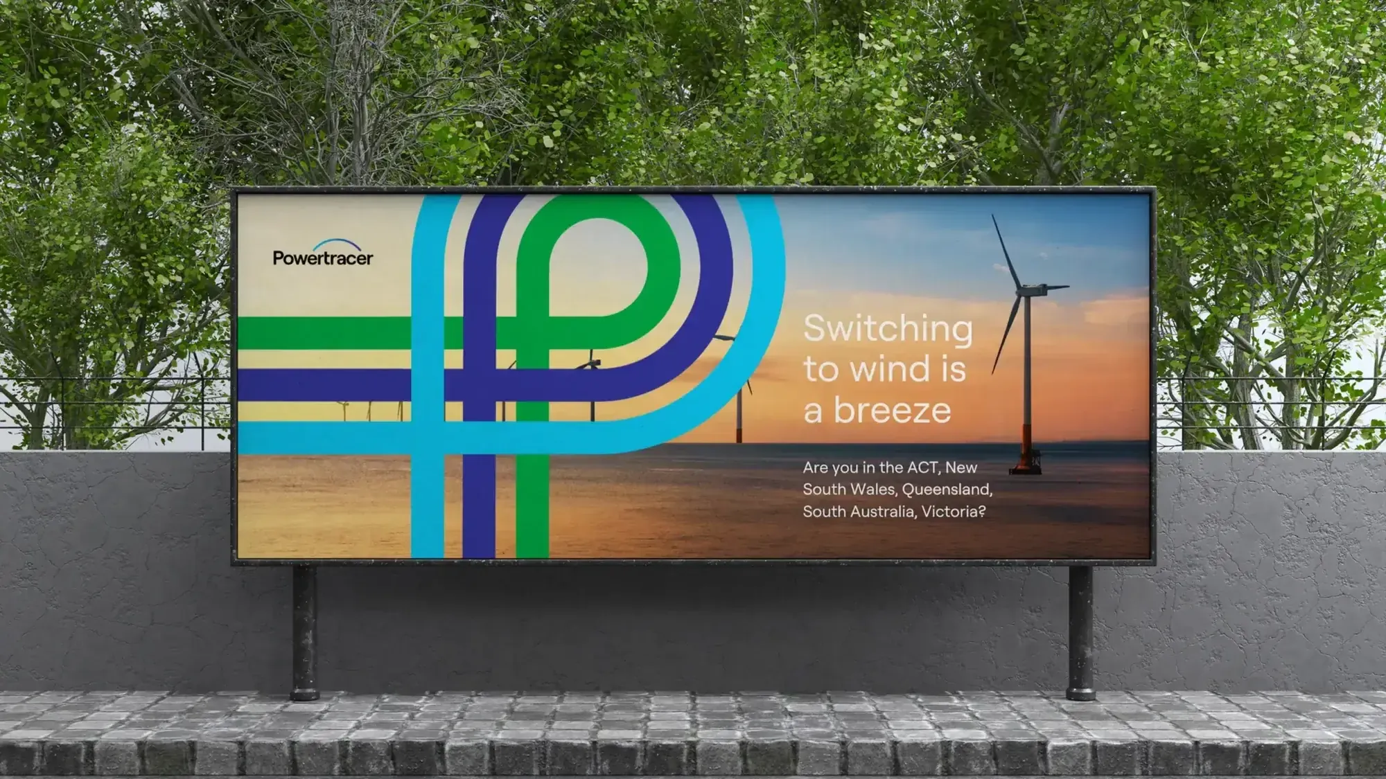 Powertracer billboard reading Switching to wind is a breeze, with a wind turbine at sunset and the brand's P monogram