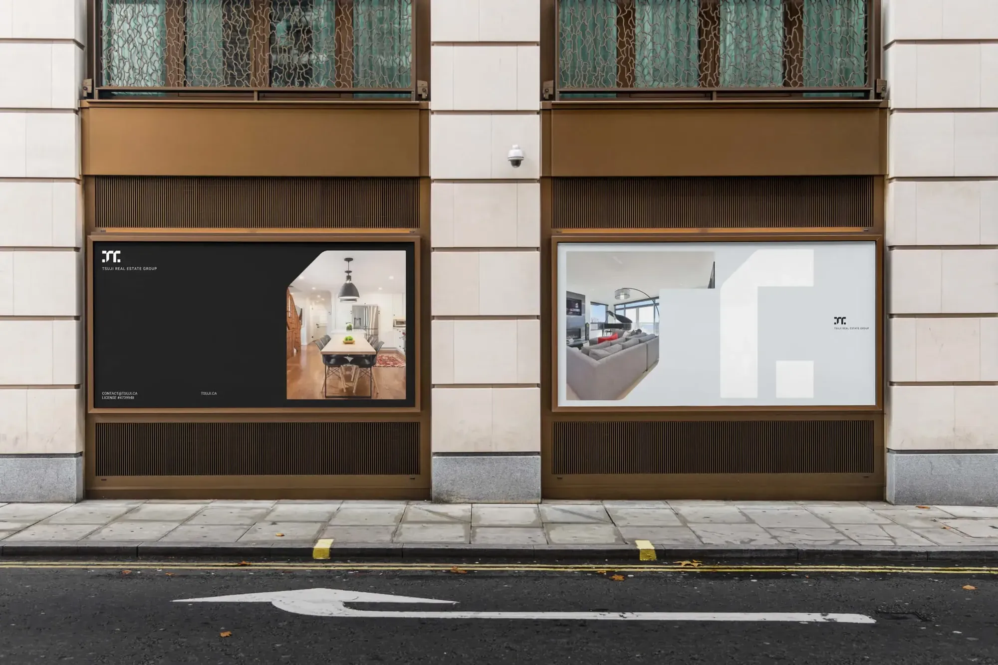 Tsuji Real Estate property ads displayed in two street-level storefront windows